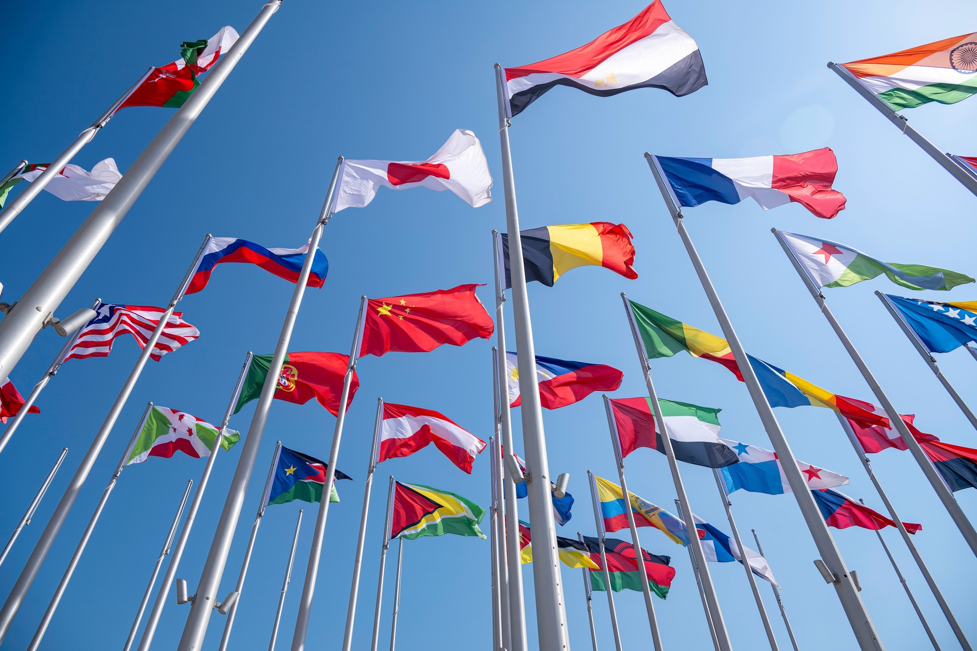 Doha, Qatar - January 23, 2025: The Flag Plaza, displays 119 flags from countries with authorized diplomatic missions, including flags of the European Union, the United Nation and the GCC.
