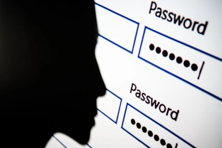 London england august 09 in this photo illustration a woman is silhouetted against a projection of a password log in dialog