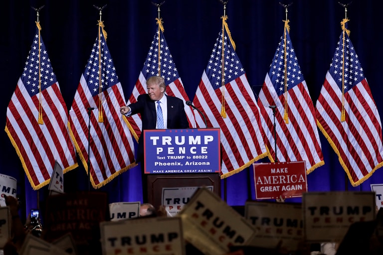 Republican presidential candidate Donald Trump points to the audience after delivering an immigration policy speech during a campaign rally at the Phoenix Convention Center, Wednesday, Aug. 31, 2016, in Phoenix. (AP Photo/Matt York)